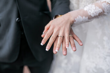 Married couple's holding hands close up