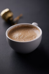 Cup of coffee on black background. Close up. Copy space.