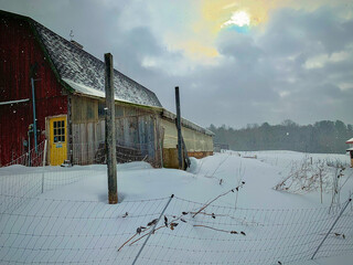 Barn on snowy hill