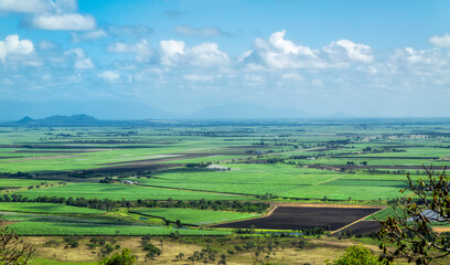 Panorama of Burdekin Queensland Australia farmland from above. Clouds cast shadows over the...