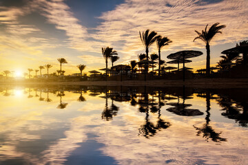 Beautiful sunset on a sandy beach at the Red Sea. Egypt, Sharm el-Sheikh.