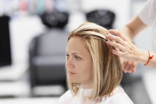 Qualified worker work with hair
