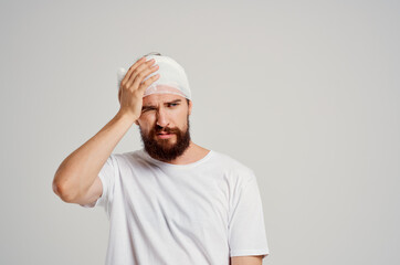 bearded man in a white t-shirt trauma health diagnosis isolated background