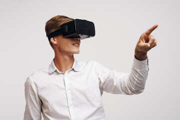 Cheerful man in a white shirt vr glasses gadget device video isolated background