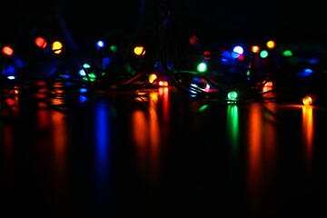 Christmas lights. Beautiful colorful abstract background with Christmas tree decorations. Concept for winter and holidays.