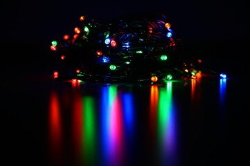 Christmas lights. Beautiful colorful abstract background with Christmas tree decorations. Concept for winter and holidays.