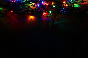Fototapeta na wymiar Christmas lights. Beautiful colorful abstract background with Christmas tree decorations. Concept for winter and holidays.