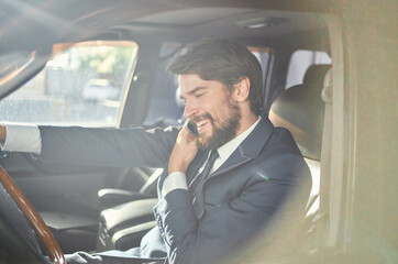businessmen Driving a car trip luxury lifestyle communication by phone