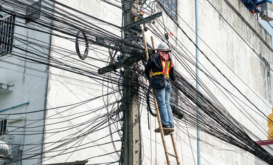 Power line on electric power pole. electricians repairing. telephone line, intercom