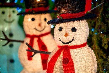 Snowman puppets at night in Dyker Heights, New York City - USA.