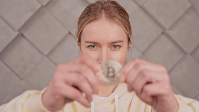 female holding sign virtual currency