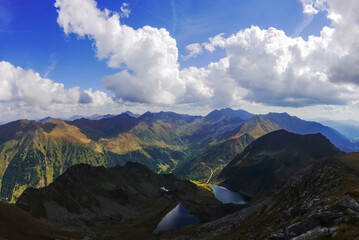 wide view to two lake and a colorful mountain range with beautiful sky panorama