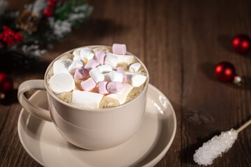 Hot Christmas drink cocoa with pile of marshmallows in big mug on wooden background