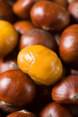 Close-up Chestnuts with peeled  isolated on white background.