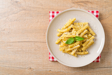 pesto rigatoni pasta with parmesan cheese
