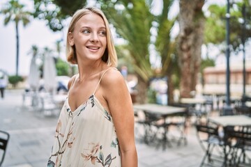 Young beautiful woman smiling confident outdoor