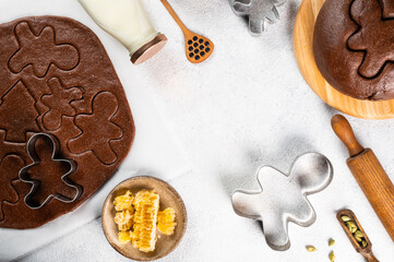 Christmas Baking background. Ingredients for cooking christmas baking on light background. Top view with copy space. Gingerbread cookies. Baking Ginger cookies. Raw dought for cookies