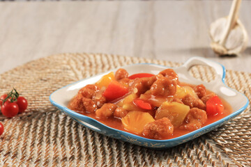 Koloke or Kuluyuk Chicken, is a Chinese Indonesian Dish Made from Crispy Chicken or Fish Seasoned with Red Sweet and Sour Sauce. Popular as Ayam Asam Manis