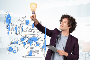 Businessman smiling finger point at lightbulb, business strategy