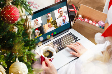 Naklejka na ściany i meble laptop with gift box and christmas lights background.