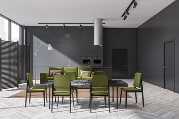 Grey and green living space with dining table and minimalist kitchen