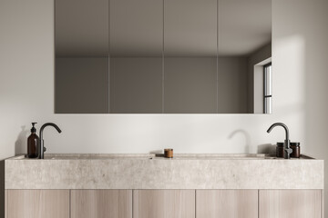 Bathroom interior with light wooden and concrete sink with mirror