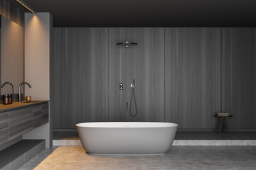Fototapeta na wymiar Grey wood look bathroom with oval ceramic bathtub