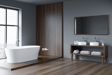 Grey and wood bathroom space with open vanity. Corner view.
