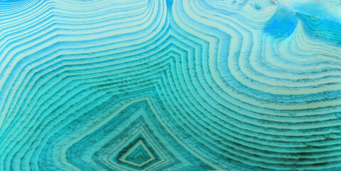 geametric lines of light and dark cyan agate texture