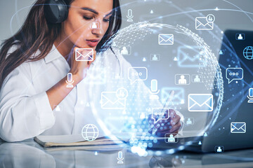 Woman take note, laptop on desk, hologram of mails and earth glo