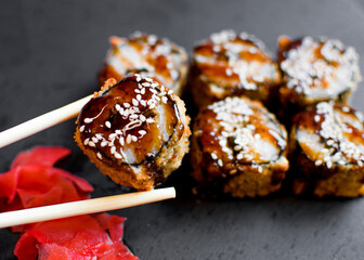 Hot sushi rolls with tuna. Asian cuisine. Fried rolls
