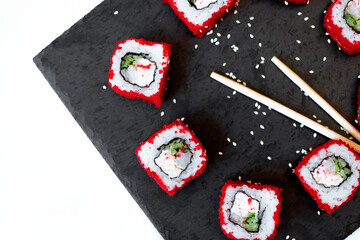 Sushi rolls - Red dragon with Tobiko caviar and tuna. Traditional Japanese cuisine. View from above. Asian cuisine.
