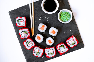 Sushi rolls - Red dragon with Tobiko caviar, salmon and tuna. Traditional Japanese cuisine. View from above. Asian cuisine.