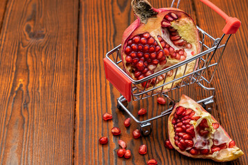 Ripe and juicy pomegranate in a shopping trolley