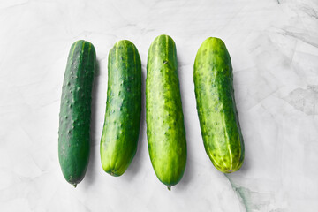  Bunch of cucumbers on a marble surface
