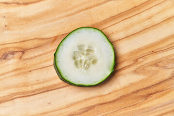  Slice of cucumber on a wooden table