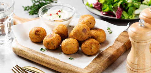 Vegetarian chickpeas falafel balls with fresh green salad. Traditional Middle Eastern and arabian food.