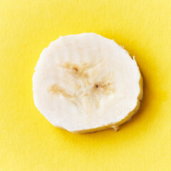  Slice of banana on a yellow background