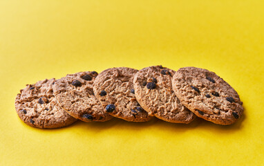  Delicious chocolate cookies on a yellow background
