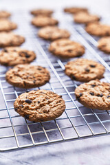  Chocolate cookies served on a grid rack on a marble table