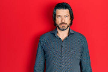 Middle age caucasian man wearing casual clothes depressed and worry for distress, crying angry and afraid. sad expression.