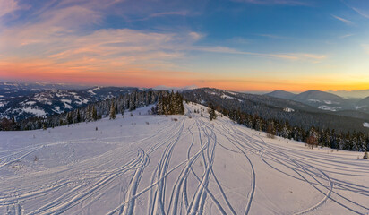 Fototapeta na wymiar Magical winter panorama of beautiful snowy slopes