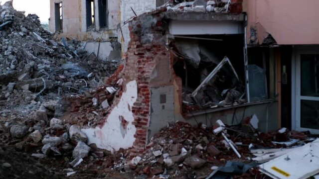 ruined house with empty windows, broken brick, cracks on the wall of a dilapidated building, the concept of ruin of people, business collapse due to Social problems, poverty, Low income, Urban decay