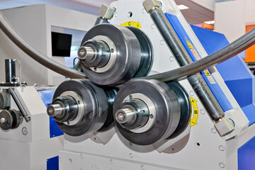 Industrial machine for bending steel pipes and metal rods. Pipe bending machine - obrazy, fototapety, plakaty