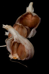 garlic on a black wooden background	