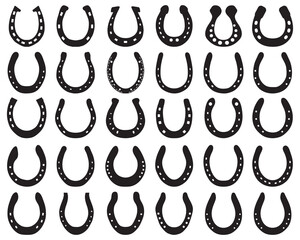 Black silhouettes of horseshoes on a white background	