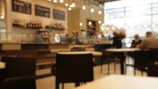 Interior of a bar with seated people