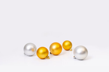 Christmas balls gold, silver colors on white background