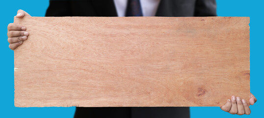 Male hand holding wooden bulletin board