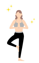 ヨガの木のポーズ（片足立ちで合掌）をするスポーツジムインストラクターの女性